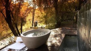 outdoor bath, white ceramic oval bathtub