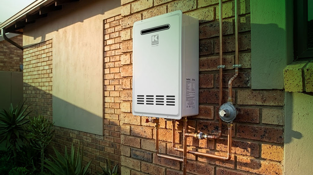 Kwikot Sirius outdoor gas water heater installed on an exterior brick wall in a South African home